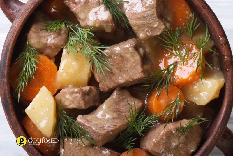 pork cooked in red wine with coriander