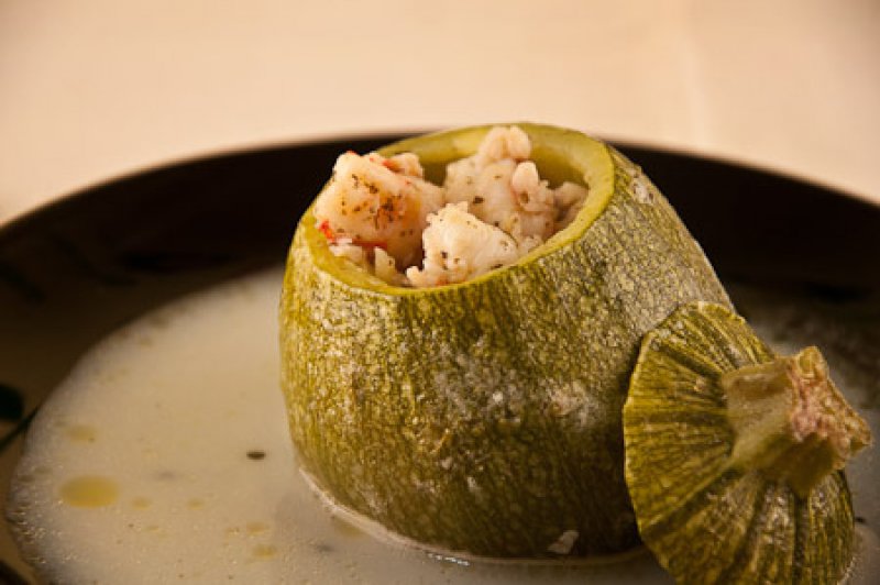 Stuffed zucchini with shrimps and egg/lemon sauce