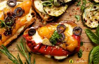 Bruschetta with Greek graviera cheese from Crete and grilled vegetables