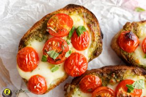 Bruschetta with grilled cherry tomatoes and Greek traditional cheese metsovone
