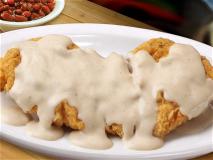 Fried Chicken Fillets with Almonds in a Feta Cheese Sauce